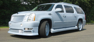 Illustration for article titled Christian Audigier Creates Snorkel-Nosed Custom Cadillac Escalade